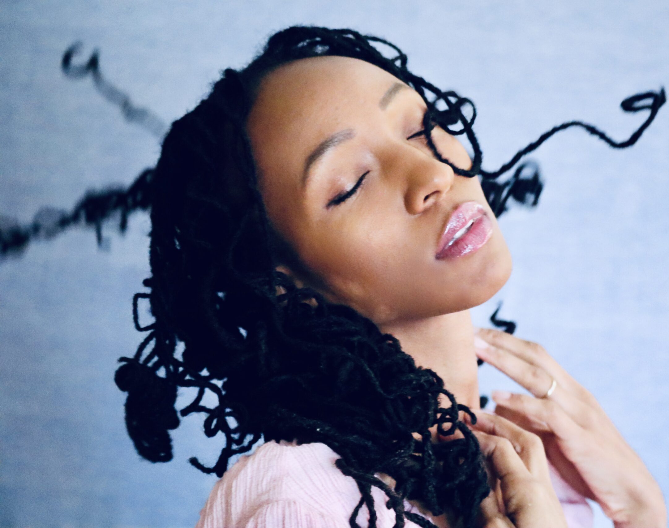 Soft natural light portrait of Lunah Moore with flowing hair and soft shadows
